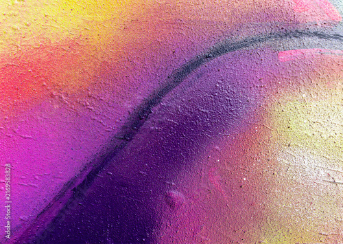 Beautiful brick wall colorful street art graffiti background. Abstract creative spray drawing fashion colors painting on the walls of the city. Urban Culture, aerosol texture