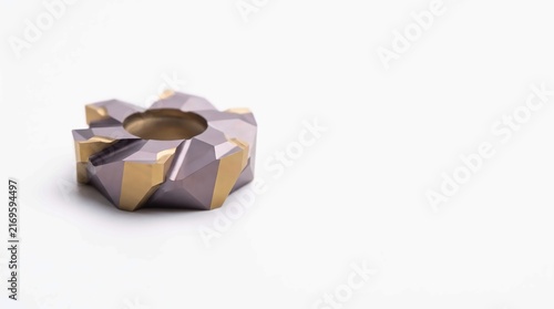 Metallic milling insert featuring sharp golden cutting edges and durable dark grey coating for industrial precision metal machining manufacturing equipment
