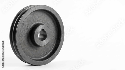 Heavy duty circular iron pulley wheel featuring a metallic textured finish with precision cut center shaft for industrial machinery applications