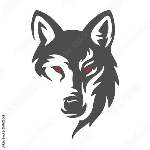 Принти на полотні Stylized wolf head icon with sharp tribal design and red eyes.