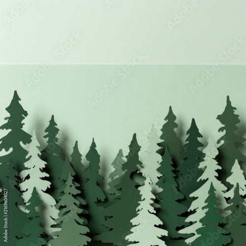Paper forest of layered pine tree silhouettes
