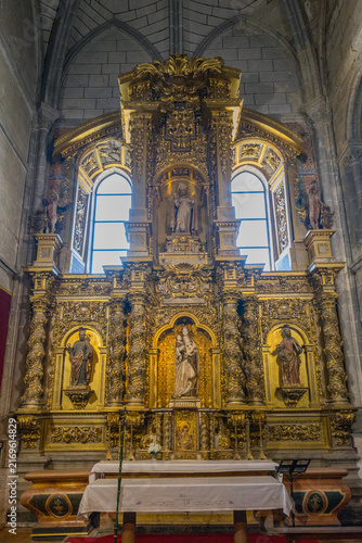 Canvas Print An ornate golden altarpiece with intricate carvings and statues