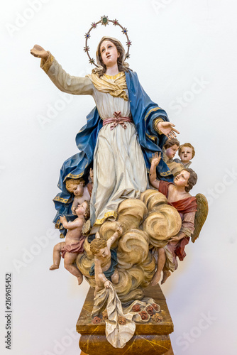 An ornate wooden sculpture of the Virgin Mary