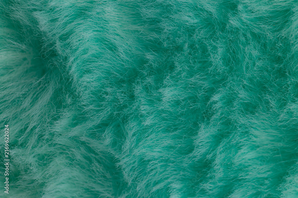 Obraz premium Macro close up of turquoise green faux fur texture background