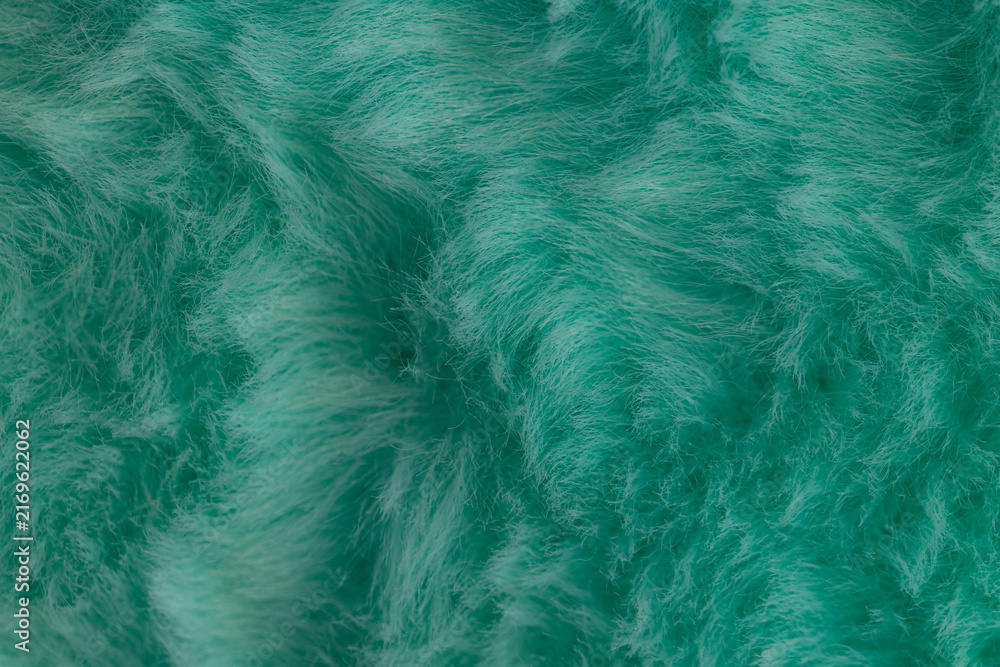 Obraz premium Macro close up of turquoise green faux fur texture background