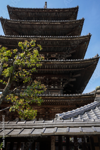 Fotografie Low angle view of a five-story pagoda roof in Kyoto, Japan