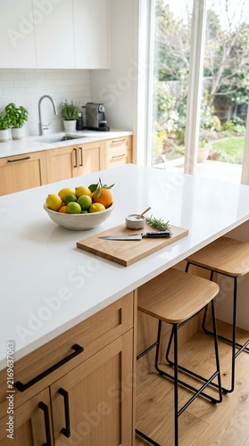Modern Kitchen Island with Fruit Bowl and Stools.