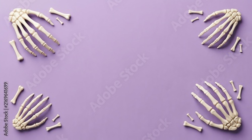 Four human skeleton hands arranged in corners on a vibrant purple background for halloween creative design projects