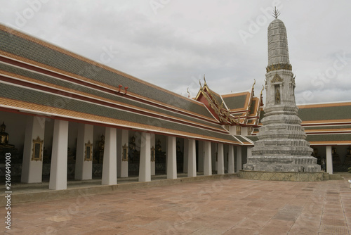 Canvas Print traditional carved stone prang tower and surrounding cloister gallery inside wat