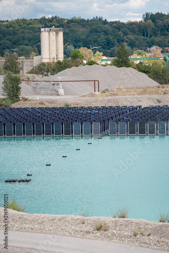 Canvas Print Vertical floating solar panels on the Gilching quarry lake in Bavaria, Germany,