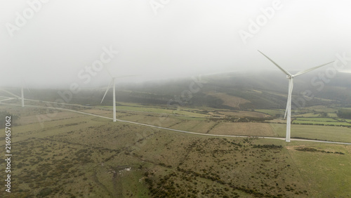Wind turbines generating clean energy in Abadin, Galicia