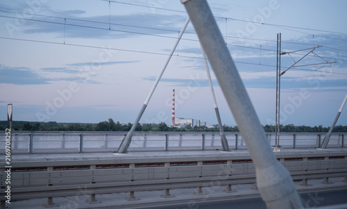 Industrial building smokestack from bridge at dusk. Thermal power plant in Novi Sad, Serbia