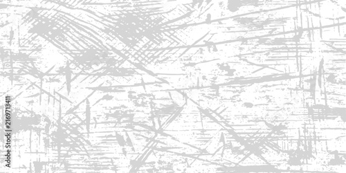 Abstract scratched surface texture with light gray distressed lines on a white background for grunge design elements