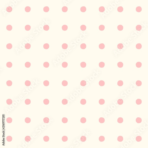 Soft pink polka dots on a cream background seamless pattern