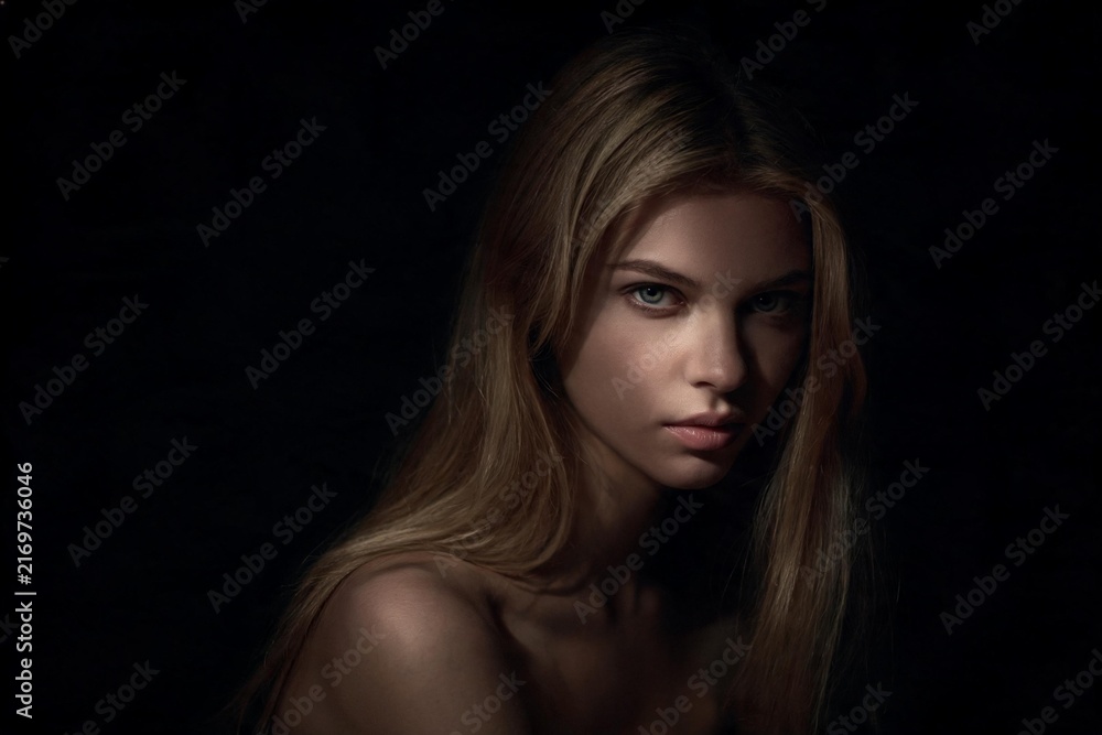 Fototapeta premium Theatrical Spotlight Lit Artistic Woman Portrait