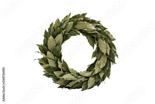 A circular wreath made of dried green bay laurel leaves arranged in a thick foliage ring for decoration isolated on a transparent background