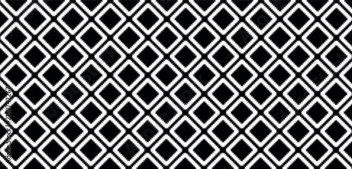 Intricate black and white seamless vector pattern featuring a textured embroidered diamond design. The tactile stitched effect adds a cozy handcrafted feel to textiles winter fashion and artisanal.