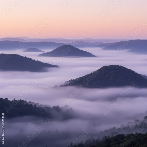 Misty Mountains Above Fog at Sunrise