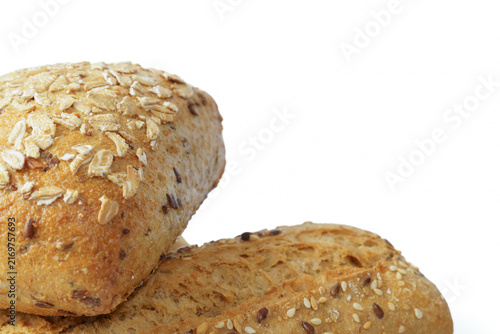 Baking whole grain bread rolls, offering healthy food for breakfast. Homemade buns showing flax, sesame seeds and oats