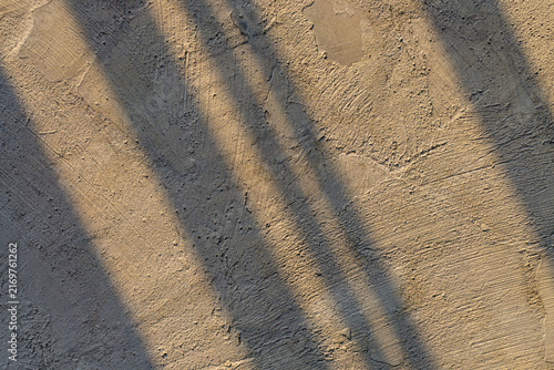 фотографія Fence Shadow Lines on Unpolished Rough Marble Stone Floor Texture Background