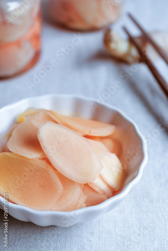 Canvastavla Close up of pink pickled ginger slices in a small white bowl