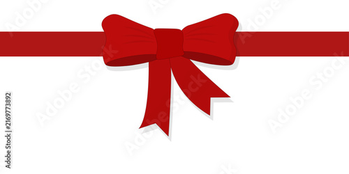 Elegant red gift ribbon with a decorative bow on a white background. Festive Christmas and holiday wrapping concept for gifts, presents, packaging, greeting cards, banners and seasonal promotions.