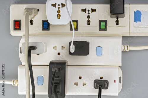 Fotografía Top-down view of multiple electrical extension cords and power strips connected