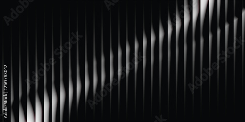 Abstract monochrome gradient background featuring a diagonal pattern of light and shadow.