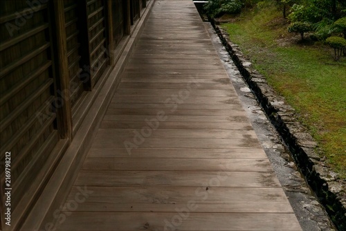 Traditional Wooden Veranda and Narrow Garden Path in Japan