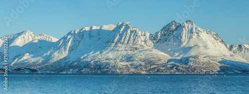 Canvas Print Snow covered mountains along Lyngen Alps in Uløya, Troms County, Norway