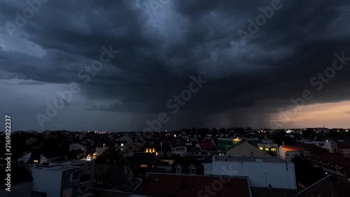 Storm Timelapse with Rain, Thunder and Lightning Over Cityscape, Day to Night transition