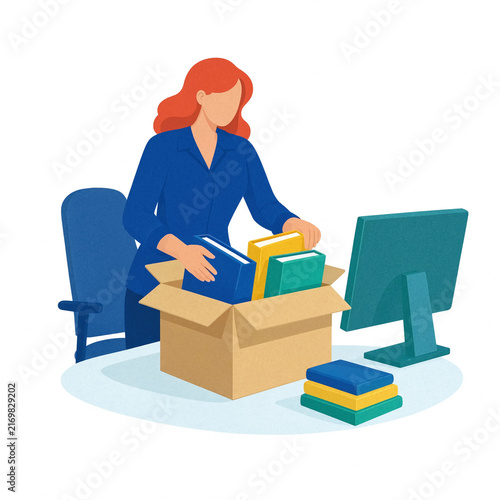 Businesswoman organizes folders and books into a cardboard box beside a computer monitor, representing office relocation, moving, organization, and workplace transition.