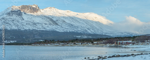 Canvas Print Snow covered mountains and coastline in Troms, Norway