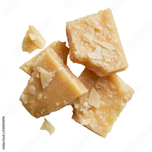 Pieces of Parmesan cheese displayed on a plain background in  showcasing mature and rough textures