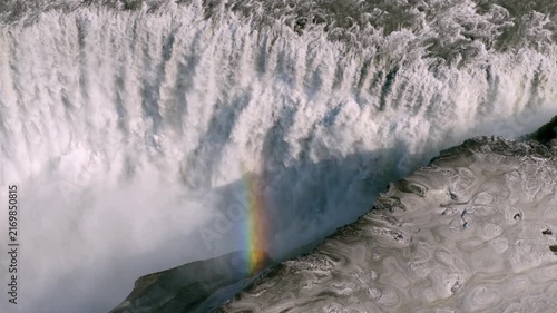 Aerial view of waterfall Dettifoss shrouded in fog and rugged terrain