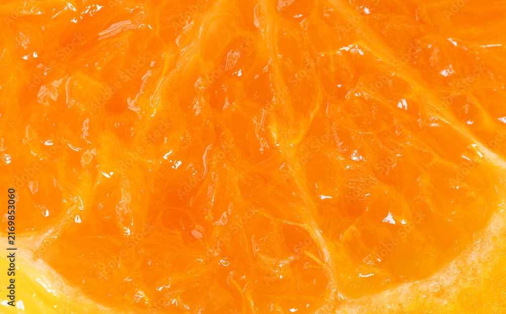 Fototapeta premium Macro Close-Up of Fresh Orange Pulp Texture,Detailed macro shot showing the juicy texture, vesicles, and vibrant orange color of a fresh ripe orange segment slice, perfect for healthy food.