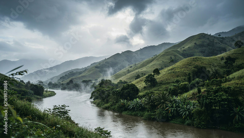 Serene mountain landscape with a winding river flowing through dense green