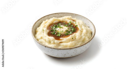 a single serving of creamy mashed potatoes in a rustic ceramic bowl
