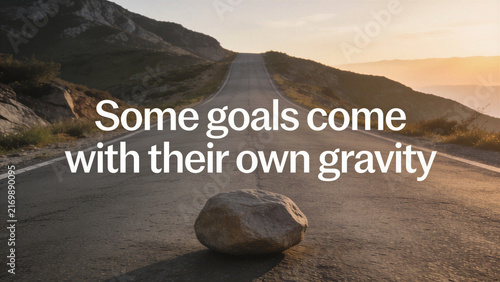 Large stone on an uphill road at sunset under white text quote 