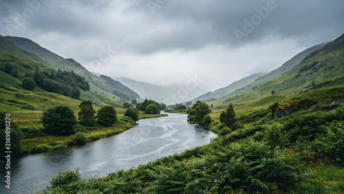 Serene mountain lake surrounded by lush green forests and towering peaks under