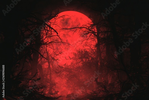 Spooky forest scene with a large red moon and flying bats at night