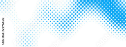 Blue halftone dots pattern fading from dense to sparse on white background