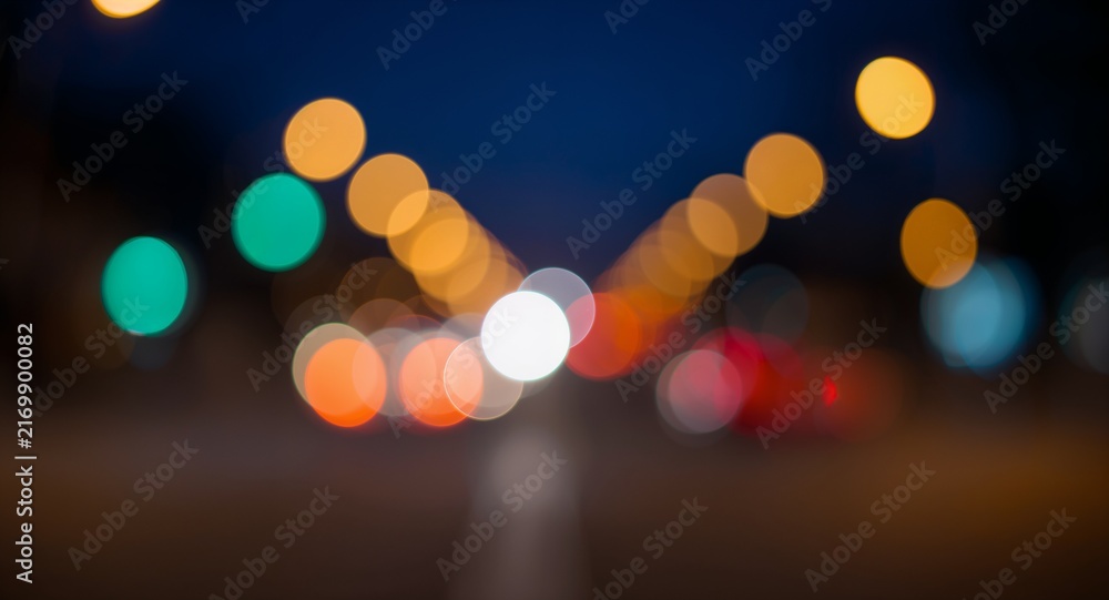 Fototapeta premium Bokeh traffic lights create a mesmerizing night scene, softly blending colors and shapes � Professional Stock Photography Concept for Commercial and Marketing Use