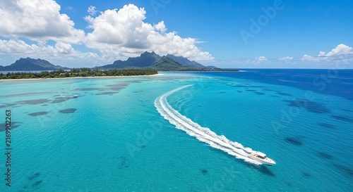 Speedboat racing across turquoise ocean waters.