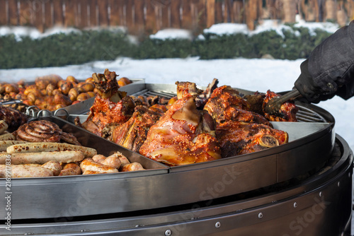 Large outdoor grill with grilled meats