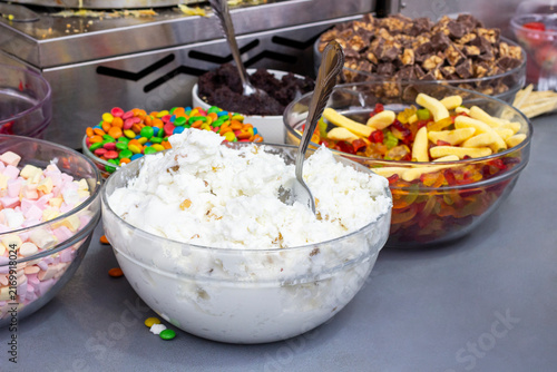 Bowls of sweets on a counter. Street food.