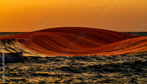 Surreal choppy ocean oil spill sunset desktop wallpaper