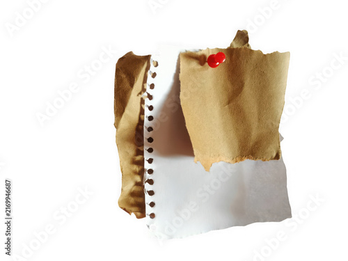 Torn piece of old vintage paper with a red pin attached