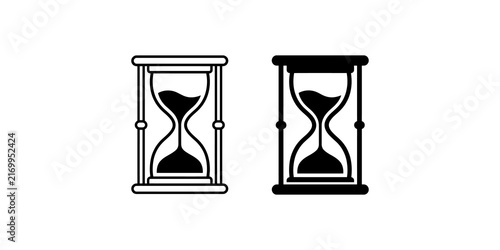 Bild auf Leinwand Two hourglass icons, one outlined and one solid, symbolizing the passage of time on a transparent background