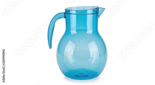 Blue glass water pitcher with handle and spout on table